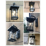 Black exterior wall fixtures with seeded glass shade
