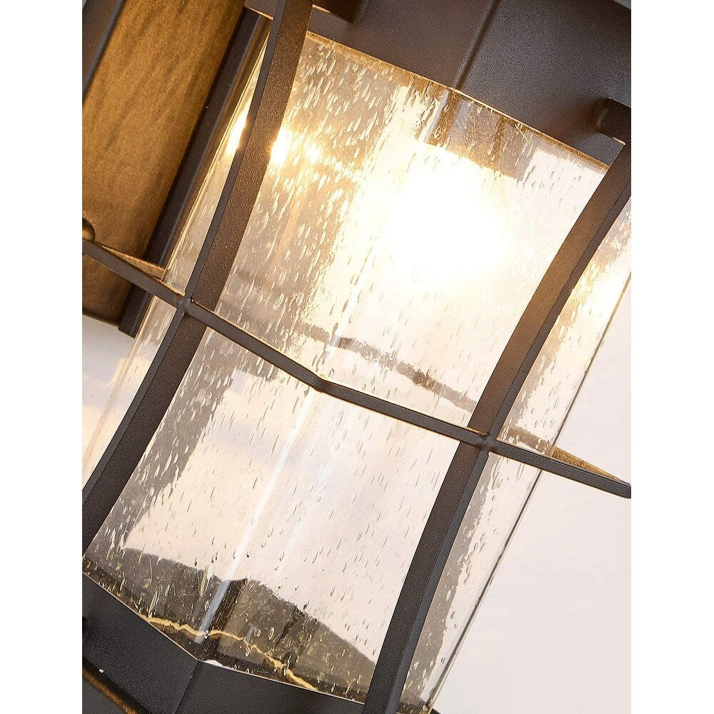 Black exterior wall fixtures with seeded glass shade