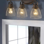 3 light industrial glass wall sconce  with rubbed bronze finish